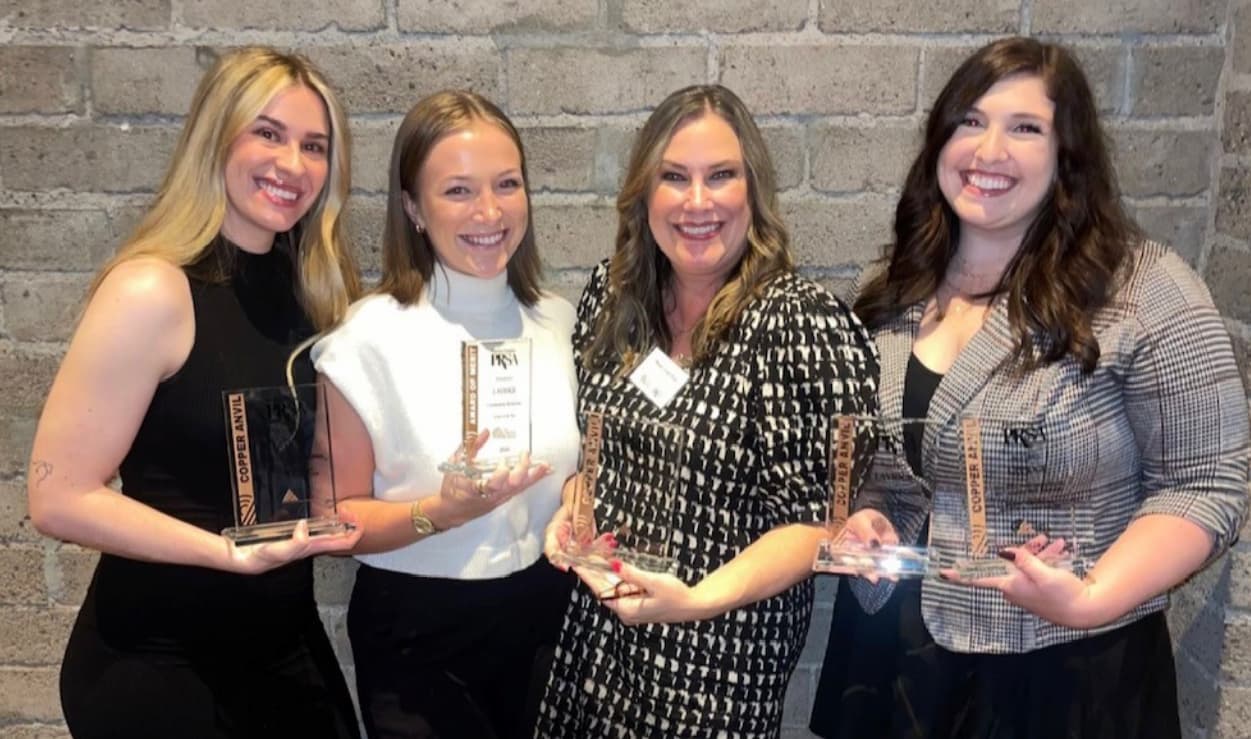 PR Team holding awards