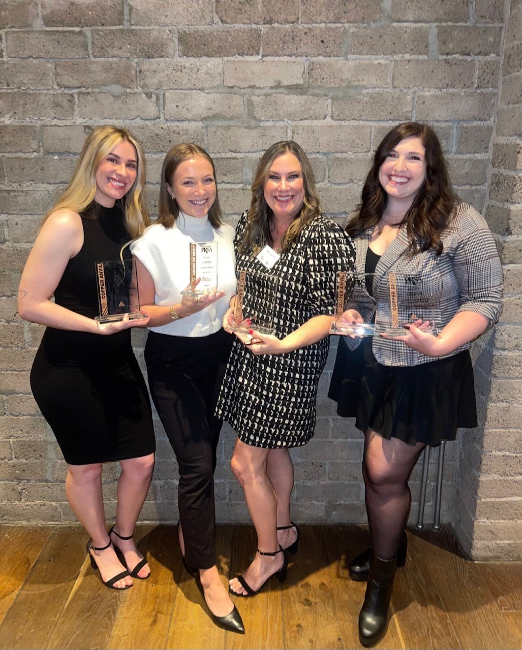 LAVIDGE employees holding trophies